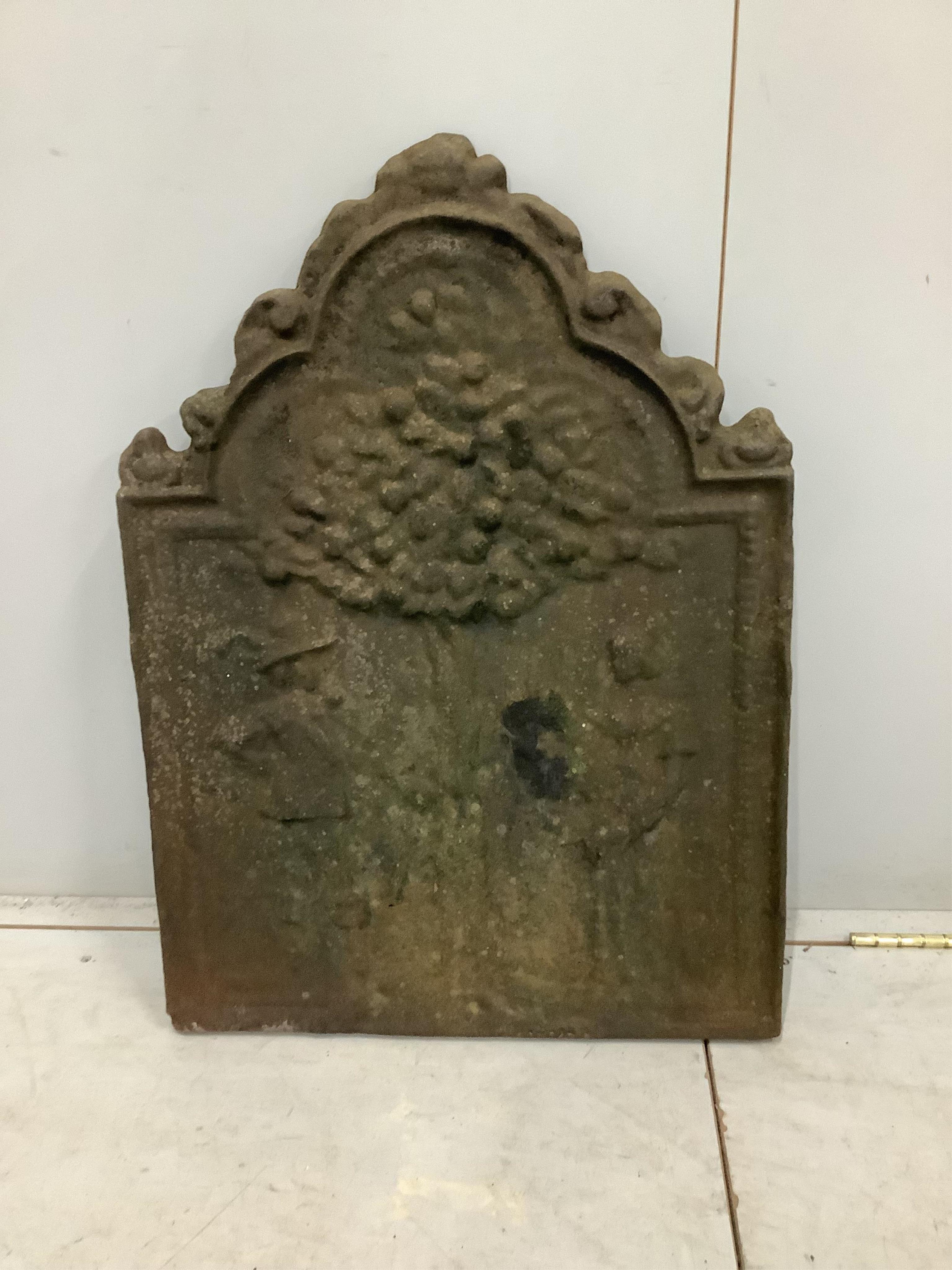 A cast iron Adam and Eve fire back, width 53cm, height 72cm. Condition - fair